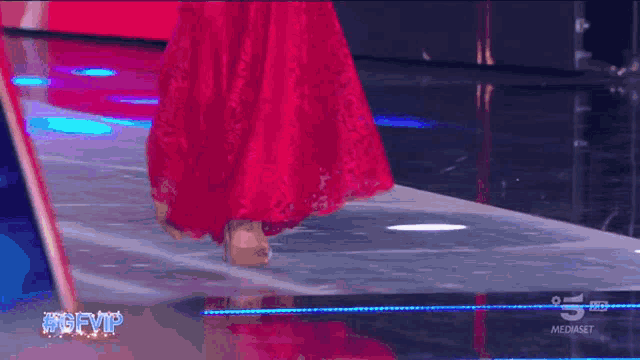 a woman in a pink dress is walking down a runway with the hashtag #gfvip