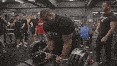 a man in a black shirt with the word grip on it