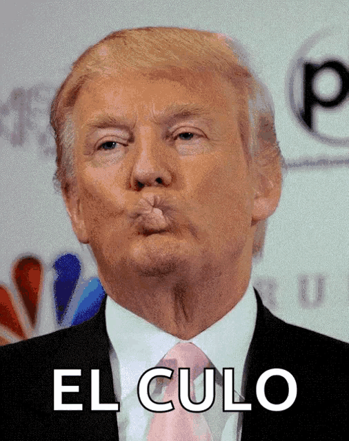 donald trump blowing a kiss with the word el culo behind him
