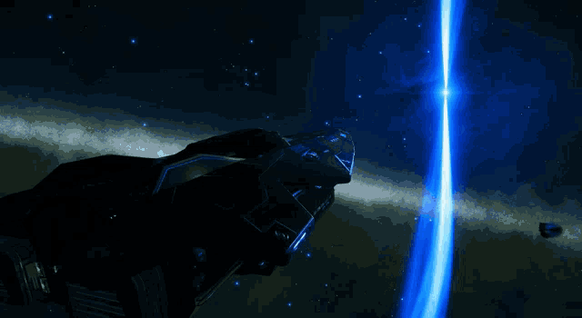 a black space ship is flying through a blue light