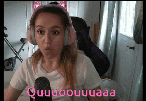 a woman wearing headphones and a white shirt says quuuoouuuaaa
