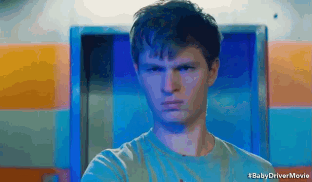 a close up of a man 's face with the words #babydrivermovie written below him