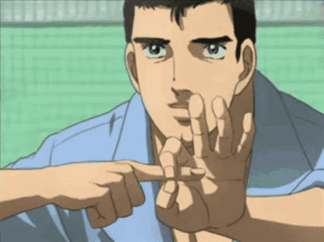 a man in a blue shirt points to his finger