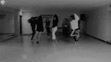a group of women are dancing in front of a sign that says happyface entertainment