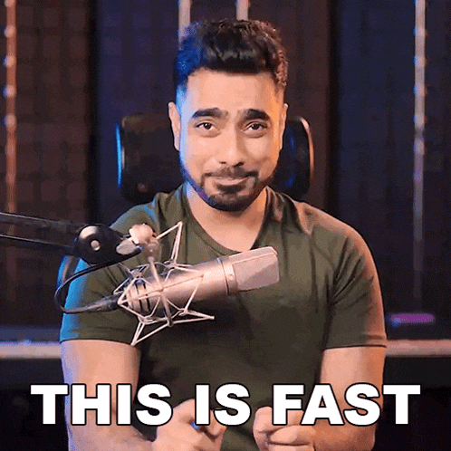 a man sitting in front of a microphone with the words " this is fast " above him
