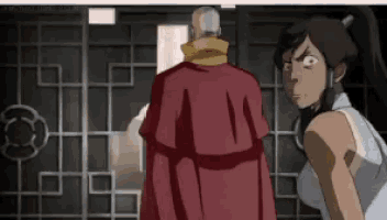 a man in a red robe is standing next to a woman in a white shirt .