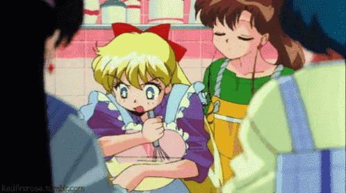 a girl with a red bow on her head is cooking