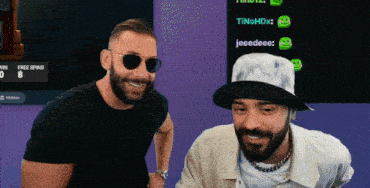 two men in front of a screen that says free spins 80
