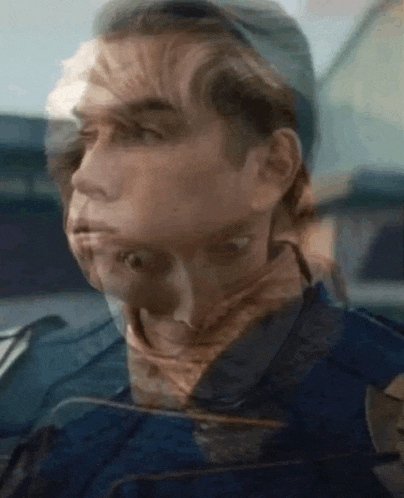 a close up of a man 's face with a double exposure of his face .