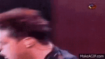 a blurry picture of a man 's head with a purple background .