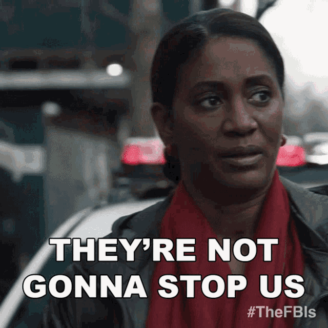 a woman says they 're not gonna stop us while standing next to a police car