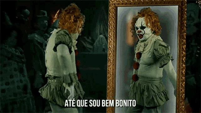 a clown is looking at his reflection in a mirror .