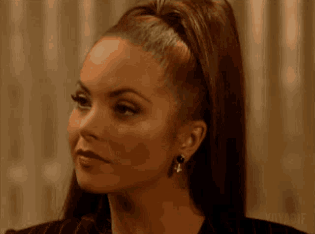 a close up of a woman 's face with the word voyage visible