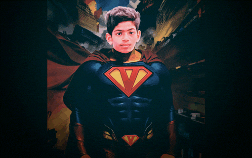 a young boy in a superman costume with the letter v on the chest