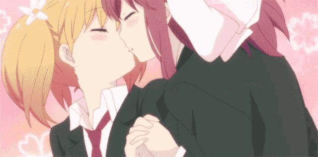 a couple of anime girls kissing each other with hearts in the background