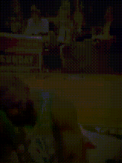 a basketball player laying on the floor in front of a sunday sign