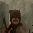 a teddy bear is holding a knife in its mouth and smiling .