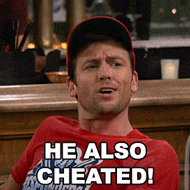 a man wearing a hat and a red shirt that says he also cheated