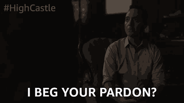 a man sitting in a chair with the words i beg your pardon