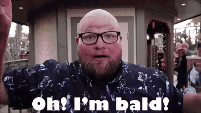 a bald man with glasses and a beard is saying oh i 'm bald