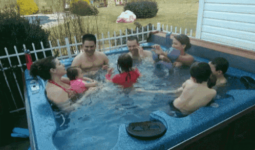 a group of people are in a hot tub