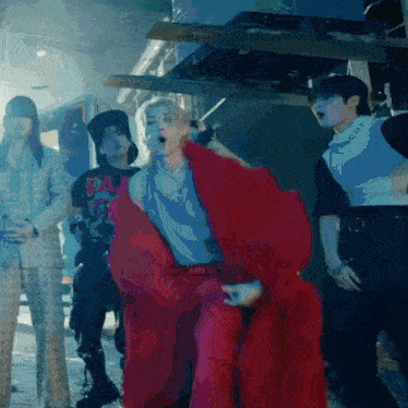 a group of people are dancing and one of them is wearing a shirt that says ' ba ' on it