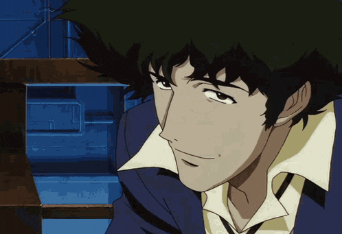 a close up of a person 's face with a blue jacket on