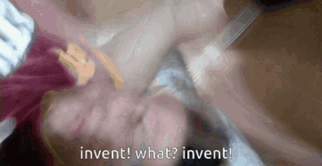 a blurred image of a person with the words invent what invent written below them