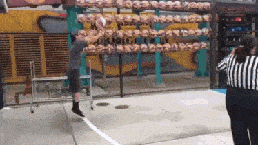 a man is jumping in the air while playing a game of basketball