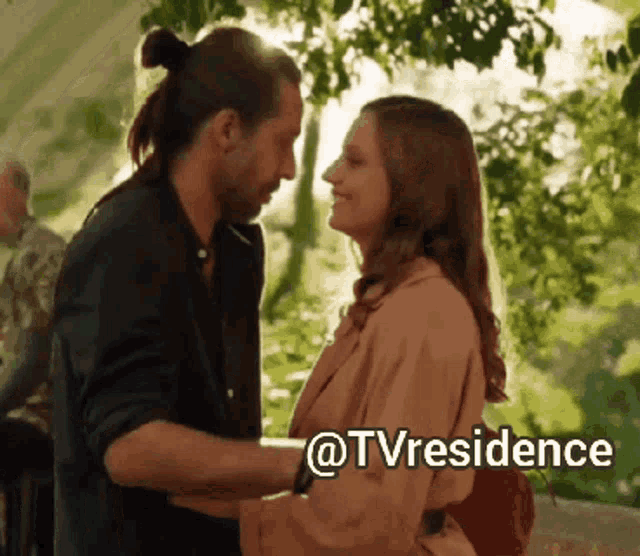 a man and a woman are looking into each other 's eyes with the caption @tvresidence