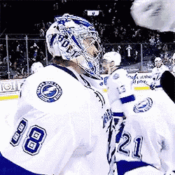 a hockey player wearing a helmet with the number 80 on it