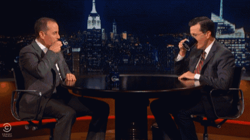 Awkward Coffee GIF - Late Night Fake News Colbert Report GIFs