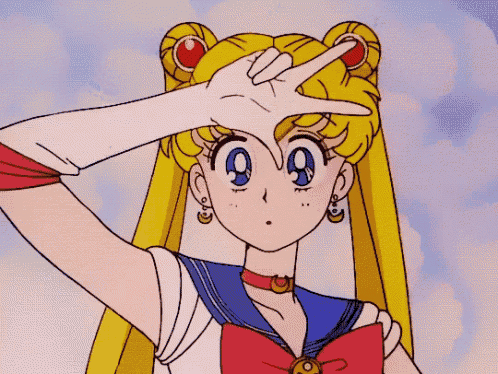 a sailor moon cartoon character is making a peace sign