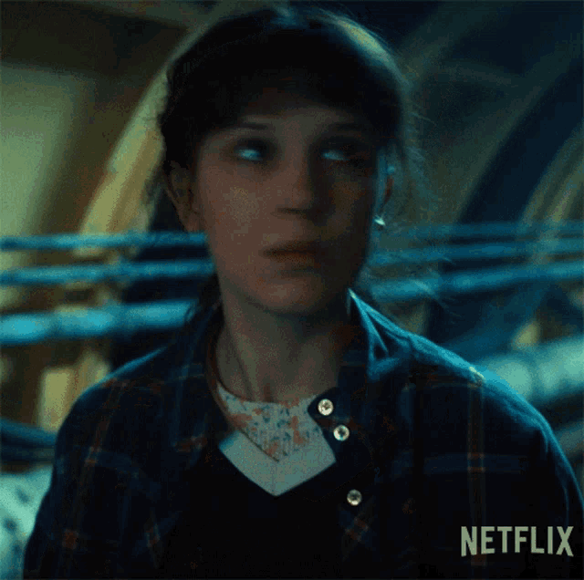 a close up of a woman 's face with netflix written on the bottom