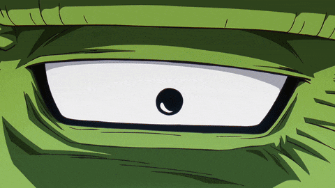 a close up of a green cartoon character 's eye with a white pupil