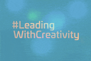 a man wearing headphones is standing in front of a blue background that says reading creativity