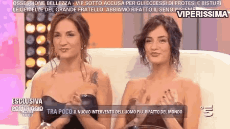 two women are sitting next to each other on a couch with the words " viperissima " on the bottom