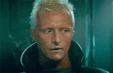 a close up of a man 's face with a collar