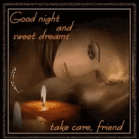a picture of a woman laying next to a candle with the words good night and sweet dreams