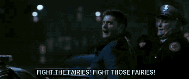 a police officer is holding a woman in front of a police car with the words fight the fairies fight those fairies