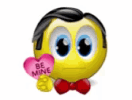 a smiley face is wearing a red bow tie and holding a pink heart that says be mine .