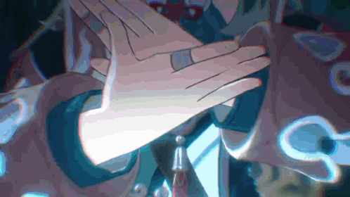 a close up of a person 's hands with a ring on them .