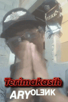 a man wearing a hat and sunglasses says terima kasih
