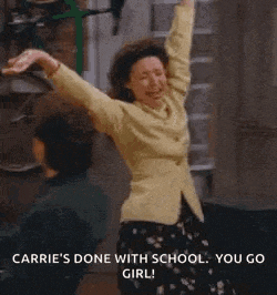 a woman is dancing with her arms in the air .