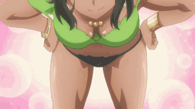 a woman in a green top and black bikini is standing with her hands on her hips ..