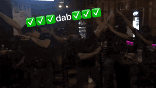 a group of people are dancing in a dark room with the words dab written above them