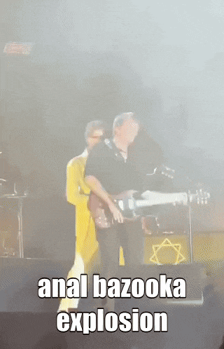 a man playing a guitar with the words anal bazooka explosion behind him