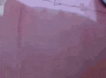 a close up of a person 's head with a purple background