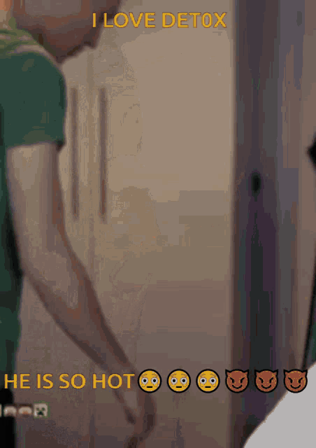 a man standing in front of a refrigerator with the words " i love detox he is so hot "