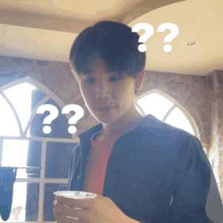 a man is holding a cup and has two question marks above his head